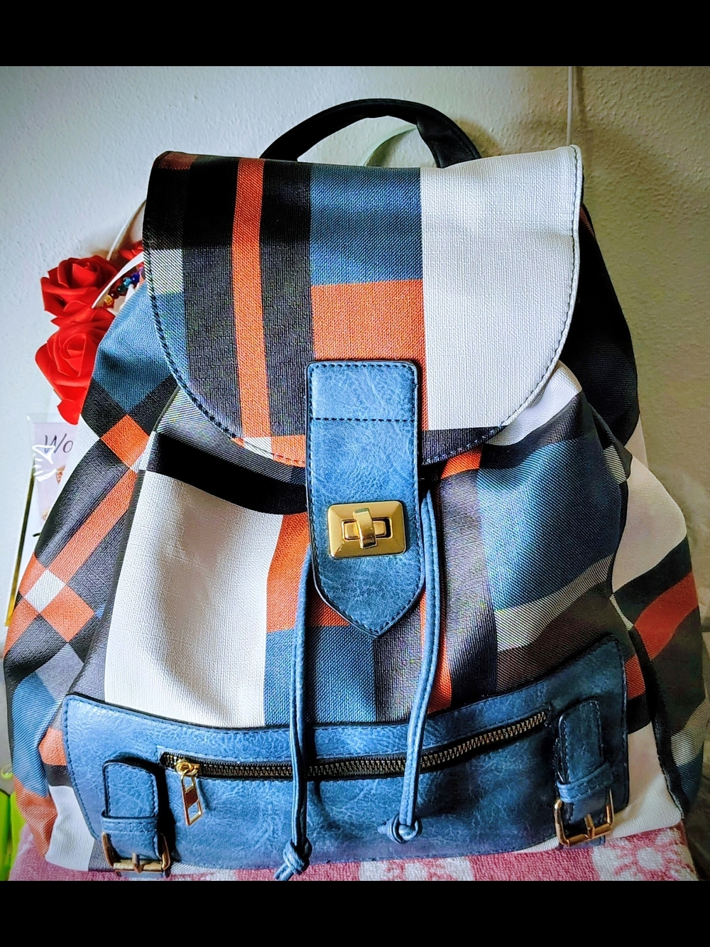 Patterned Canvas Backpack with Blue Trim and Gold Hardware